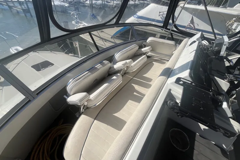 Slide: The Image of Interior view of 1992 Carver 33 Aft Cabin Motor Yacht with seating and helm. - 14