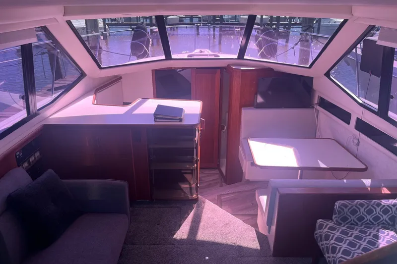 Slide: The Image of Interior of 1992 Carver 33 Aft Cabin Motor Yacht with seating and dining area. - 16