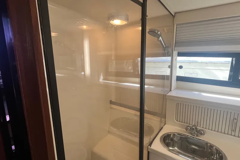 Slide: The Image of Shower and sink area in 1992 Carver 33 Aft Cabin Motor Yacht bathroom. - 34