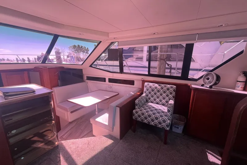 Slide: The Image of Interior of 1992 Carver 33 Aft Cabin Motor Yacht with seating and table. - 18