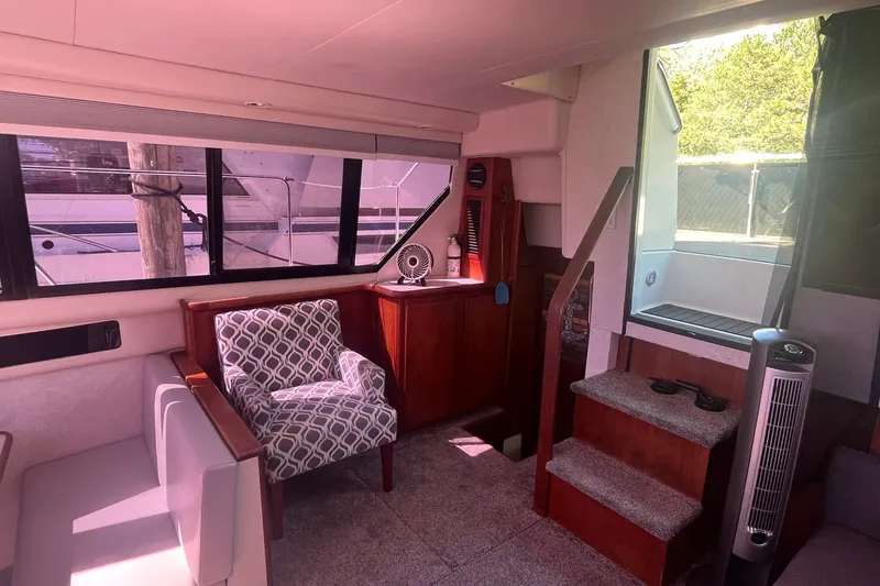 Slide: The Image of Interior of 1992 Carver 33 Aft Cabin Motor Yacht with seating and stairs. - 31