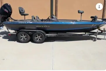 Slide: The Image of 2018 Falcon F205 boat on trailer, blue and black design, parked outdoors. - 1