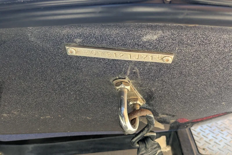 Slide: The Image of Close-up of a Falcon F205 2018 vehicle's VIN plate and hook detail. - 10