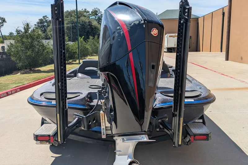 Slide: The Image of 2018 Falcon F205 boat with powerful outboard motor, parked on concrete driveway. - 9