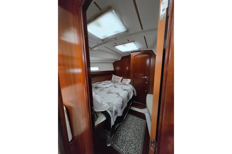 Slide: The Image of Cozy cabin interior of 2004 Beneteau Oceanis 393 sailboat with wooden finish. - 12