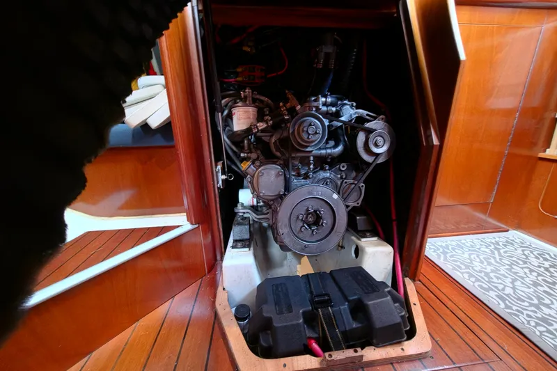 Slide: The Image of Engine compartment of a 2004 Beneteau Oceanis 393 sailboat, showcasing detailed mechanics. - 18