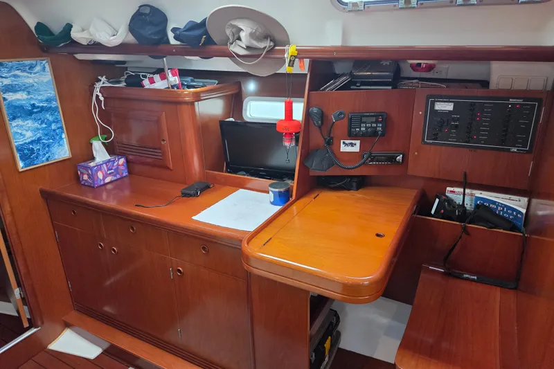 Slide: The Image of Interior of a 2004 Beneteau Oceanis 393 sailboat with navigation equipment. - 15