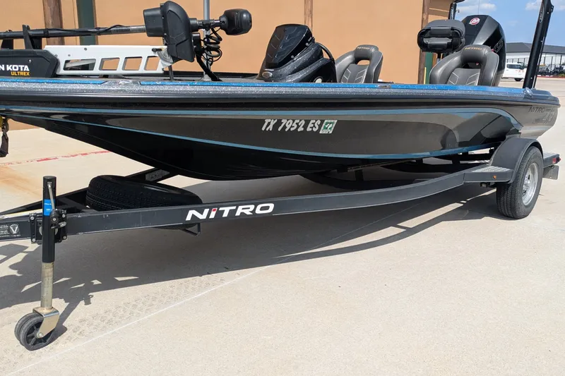 Slide: The Image of 2019 Nitro Z18 boat on trailer, featuring Minn Kota Ultrex motor. - 2