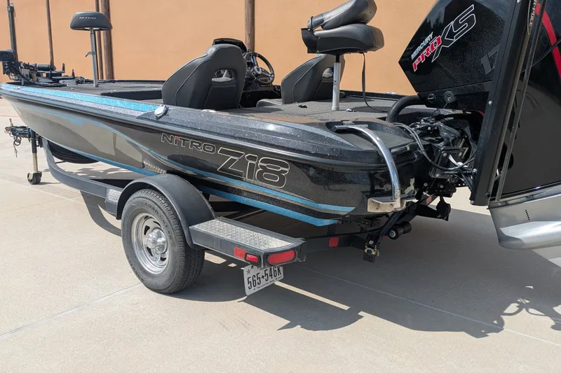 Slide: The Image of 2019 Nitro Z18 boat on trailer, featuring sleek black design and Mercury Pro XS engine. - 3
