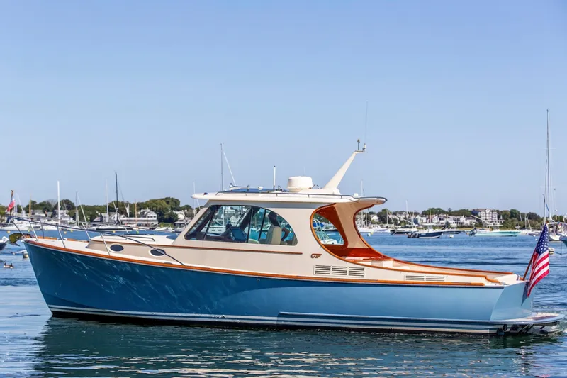 The Image of 2017 Hinckley Picnic Boat 37 MKIII cruising on calm waters, showcasing elegant design. - 0