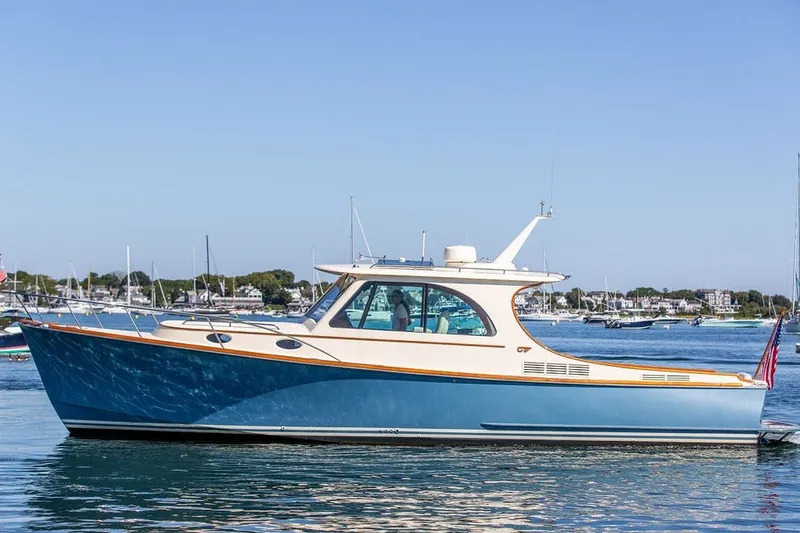 The Image of 2017 Hinckley Picnic Boat 37 MKIII cruising on calm waters. - 0