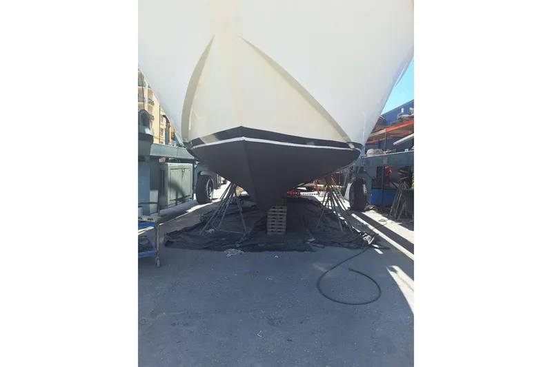 Slide: The Image of 1988 Birchwood 44TS yacht in dry dock, hull maintenance underway. - 48