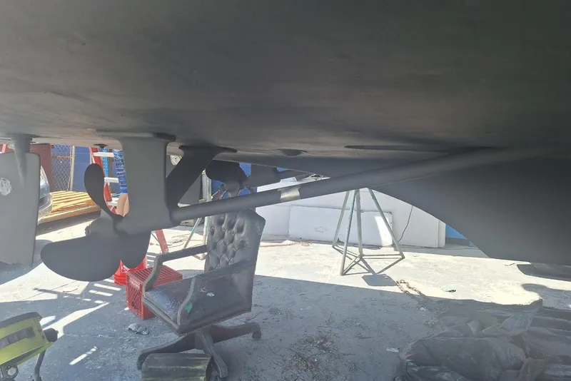 Slide: The Image of Underneath view of a 1988 Birchwood 44TS boat showing propeller and rudder. - 52