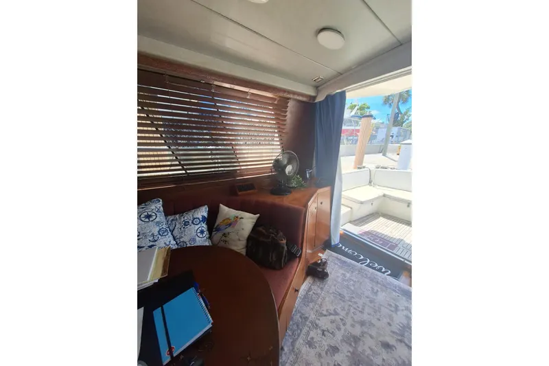 Slide: The Image of Interior of 1988 Birchwood 44TS yacht with cozy seating and nautical decor. - 23