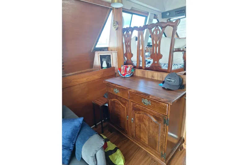 Slide: The Image of Interior of 1988 Birchwood 44TS boat with wooden furniture and decor. - 40