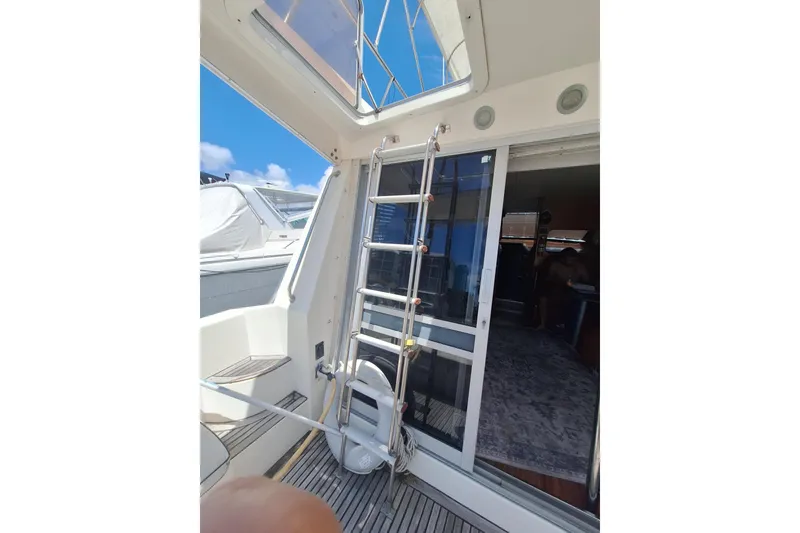 Slide: The Image of Interior view of 1988 Birchwood 44TS yacht with ladder and sliding door. - 26