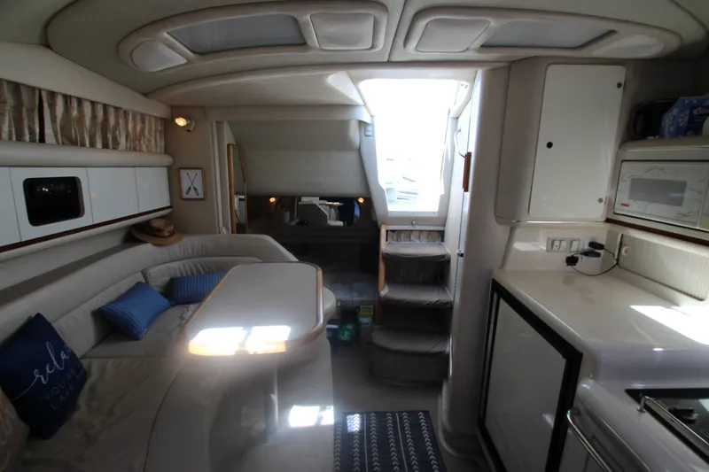 Slide: The Image of Interior of 1996 Sea Ray Sundancer 330 yacht, featuring cozy seating and modern amenities. - 27