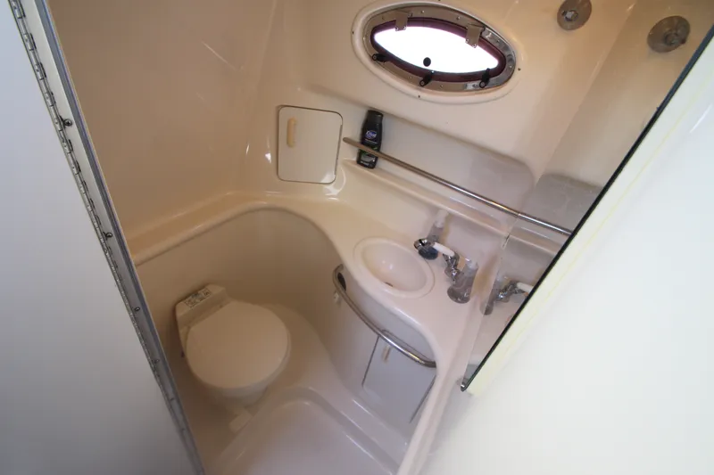 Slide: The Image of Bathroom interior of 1996 Sea Ray Sundancer 330 yacht, featuring compact design and amenities. - 33