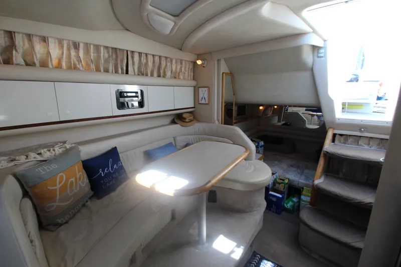 Slide: The Image of Interior of a 1996 Sea Ray Sundancer 330 yacht with cozy seating and elegant decor. - 28