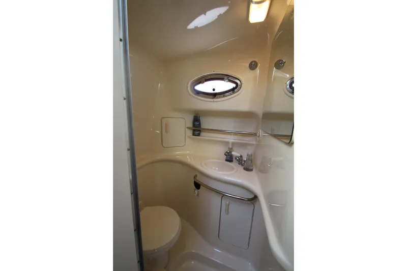 Slide: The Image of Bathroom interior of 1996 Sea Ray Sundancer 330 yacht, featuring sink and toilet. - 31