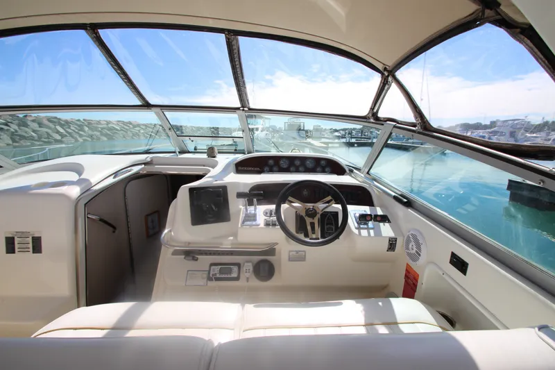 Slide: The Image of Cockpit view of a 1996 Sea Ray Sundancer 330, showcasing steering and controls. - 13