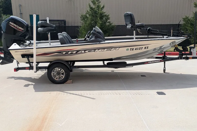 The Image of 2022 Tracker Pro Team 175 TXW Tournament Edition boat on trailer, side view. - 0