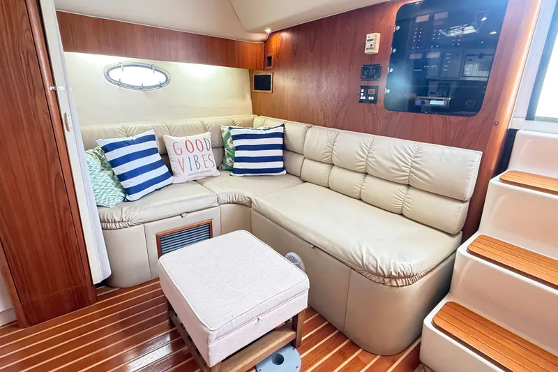 Slide: The Image of Luxurious 1997 Tiara 3500 EXPRESS yacht interior with cozy seating and nautical decor. - 14