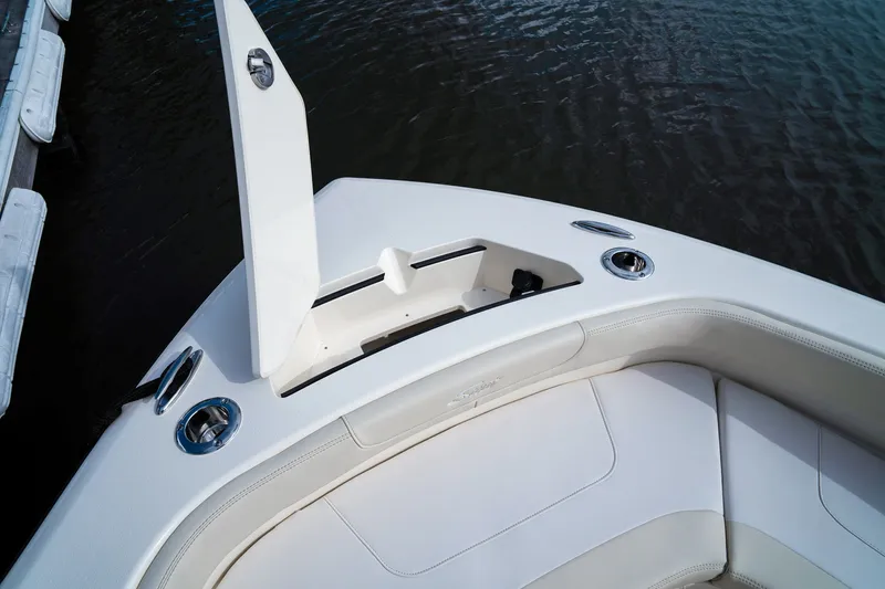 Slide: The Image of The 2027 Scout 200 Sportfish features a sleek, white deck with stainless steel fittings. - 28