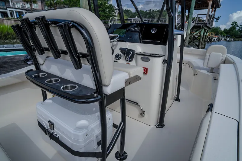 Slide: The Image of The image shows the cockpit of a 2027 Scout 200 Sportfish boat with modern controls. - 32