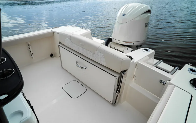Slide: The Image of The image shows the stern of a Scout 200 Sportfish boat with an outboard motor. - 17