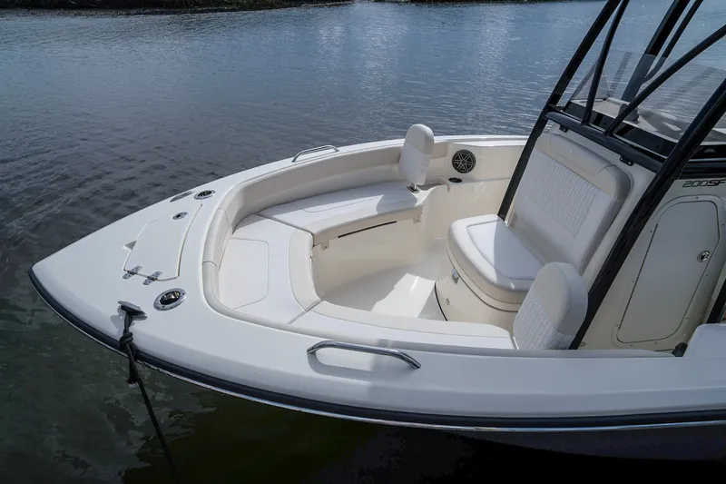 Slide: The Image of Scout 200 Sportfish 2027 with sleek white upholstery and spacious bow area. - 18