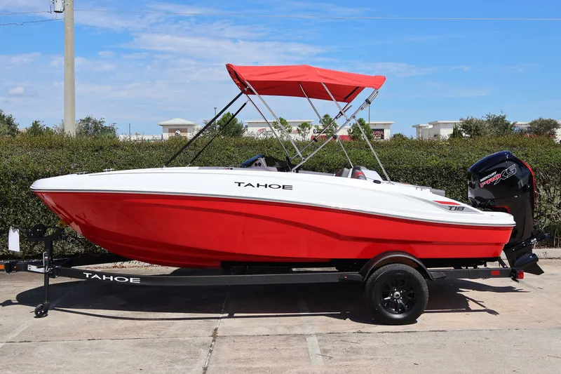 The Image of Red and white 2027 Tahoe T18 boat with canopy on trailer. - 0