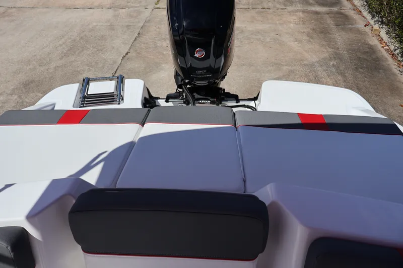Slide: The Image of 2027 Tahoe T18 boat with sleek seating and powerful outboard motor. - 14