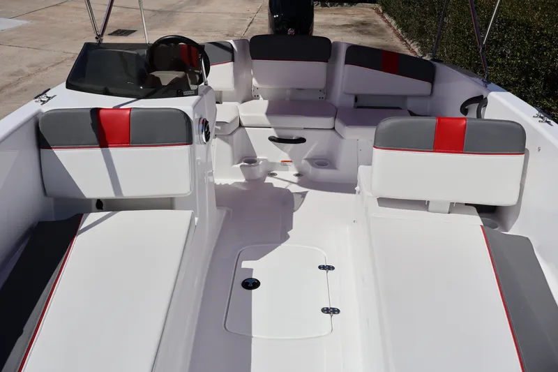 Slide: The Image of Interior of 2027 Tahoe T18 boat with white and red seating, modern design. - 9