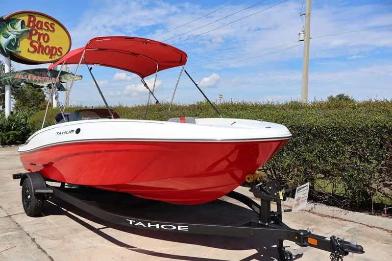 Slide: The Image of 2027 Tahoe T18 boat with red hull on trailer at Bass Pro Shops. - 5