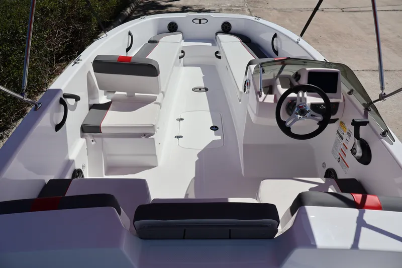 Slide: The Image of Interior view of 2027 Tahoe T18 boat with modern seating and steering console. - 8