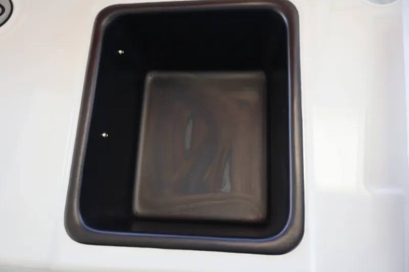 Slide: The Image of Black storage compartment in 2027 Tahoe T18 boat. - 22
