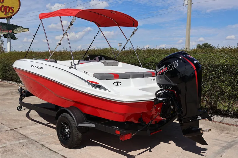 Slide: The Image of 2027 Tahoe T18 boat with red canopy and Mercury Pro XS engine. - 3