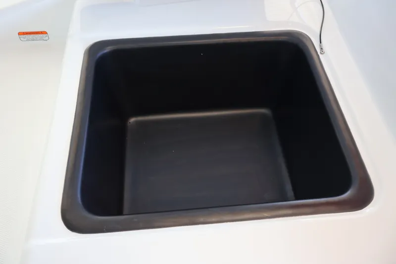 Slide: The Image of Black storage compartment in 2027 Tahoe T18 boat. - 23