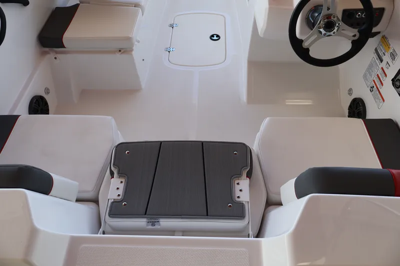 Slide: The Image of Interior of a 2027 Tahoe T18 boat featuring seating and steering wheel. - 12