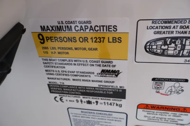 Slide: The Image of 2027 Tahoe T18 boat capacity label: 9 persons or 1237 lbs, 115 HP motor. - 28