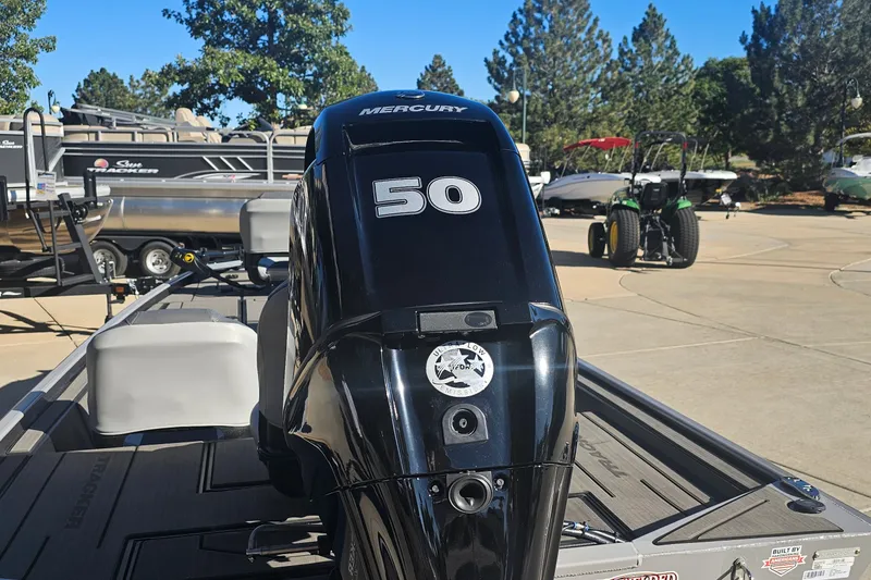 Slide: The Image of 2027 Tracker Pro 170 boat with Mercury 50 outboard motor in a sunny outdoor setting. - 14