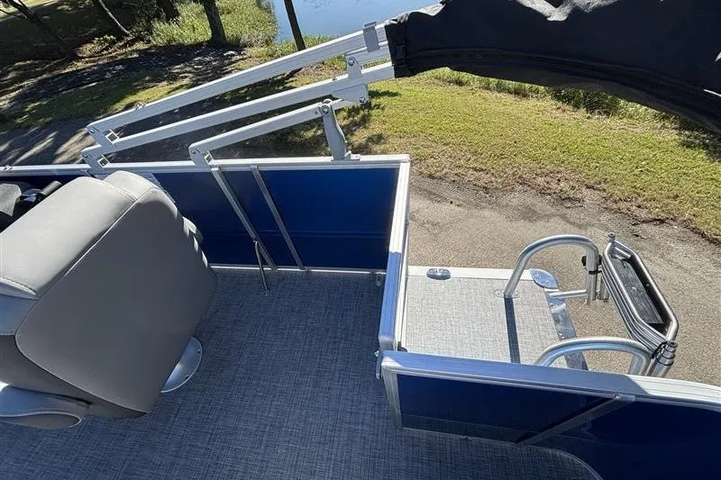 Slide: The Image of 2027 Sun Tracker Party Barge 18 DLX pontoon boat with seating and railing. - 26