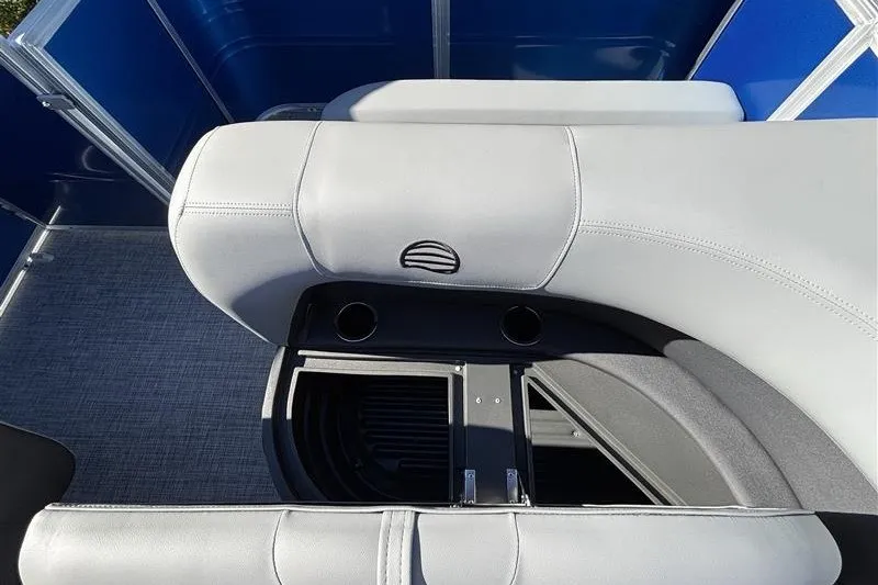 Slide: The Image of 2027 Sun Tracker Party Barge 18 DLX interior seating with cup holders and storage. - 24