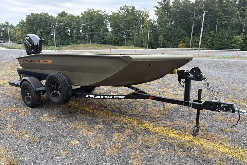 The Image of 2027 Tracker Grizzly 1553 Timber boat on trailer, parked outdoors. - 0