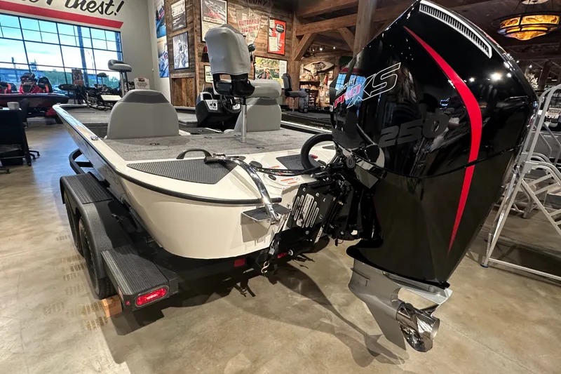 Slide: The Image of 2027 Tracker Savage 215 boat with powerful Mercury Pro XS 250 engine displayed indoors. - 13