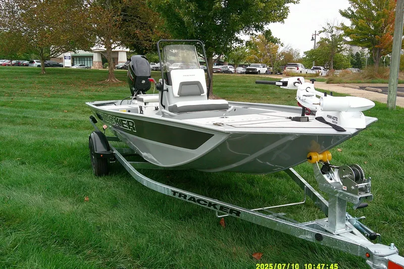 The Image of 2027 Tracker Bass Tracker Classic CC boat on trailer, parked on grass. - 0