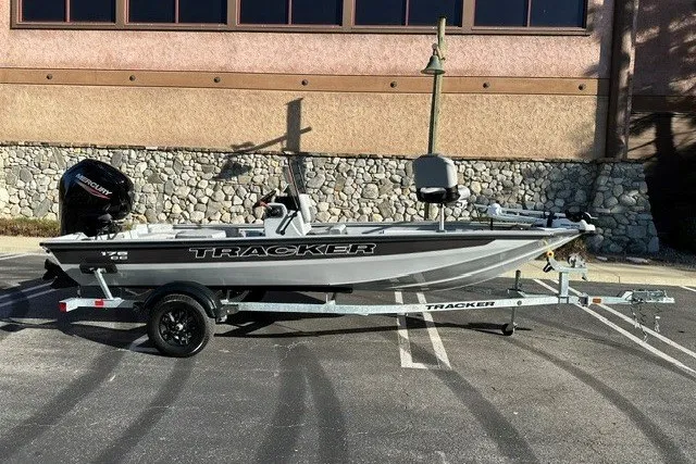 The Image of 2027 Tracker Bass Tracker 175 CC boat on trailer, parked outdoors. - 0