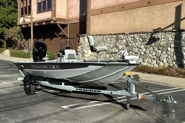 The Image of 2027 Tracker Bass Tracker 175 CC boat on trailer, parked outdoors. - 0