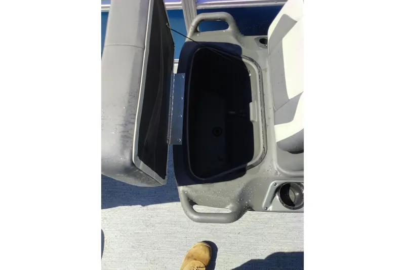 Slide: The Image of Open storage compartment on 2027 Sun Tracker Bass Buggy 18 DLX boat. - 15